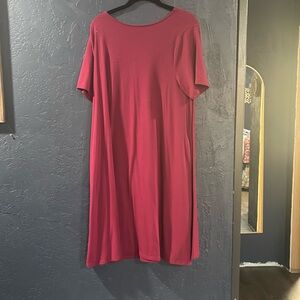 Wine colored t shirt material dress with pockets.